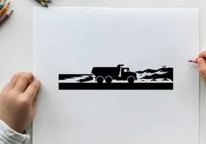 Silhouette of a truck driving on a road with mountains