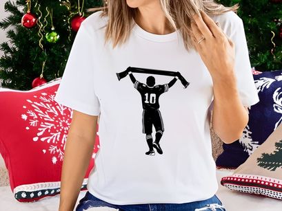 Silhouette of a sports player celebrating with a scarf