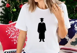 Graduate student holding diploma in academic gown and cap silhouette