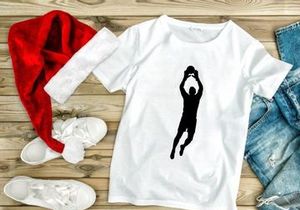 A silhouette of a person playing basketball with a ball