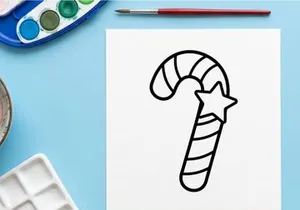 Hand-drawn candy cane with star for festive Christmas holiday celebration decoration