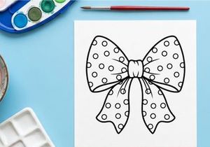 Polka dot gift bow illustration, black and white decorative ribbon for Christmas design.
