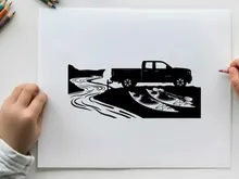 Silhouette of a pickup truck on a winding road in a rural silhouette landscape