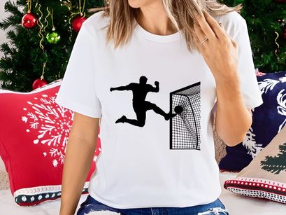 Soccer goalkeeper diving to block a shot on goal in a football match