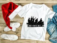Black silhouette illustration of a group of people cheering and celebrating on a bench