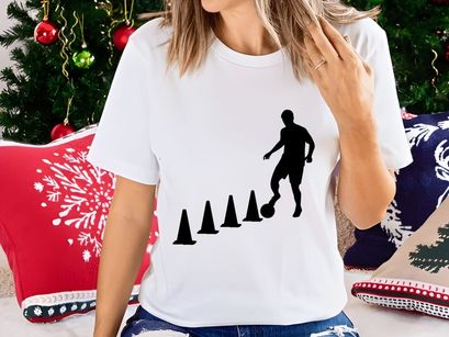 Soccer player skillfully navigating through cones in training session