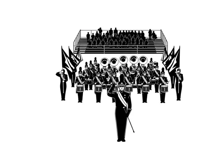 Marching band performance in silhouette at outdoor stadium