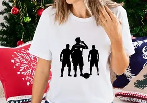 Three soccer players in black silhouette with a ball