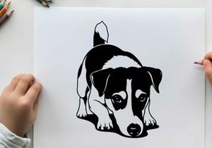 Silhouette of a cute black and white dog crouching down