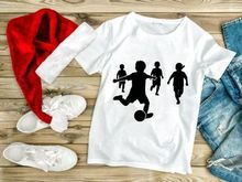 Children playing soccer silhouette