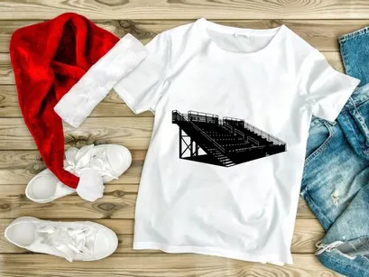 Black and white image of a large outdoor stadium seating structure with metal railings