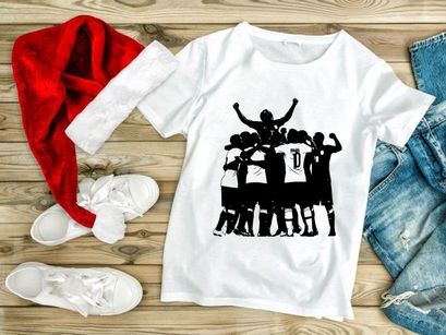 Soccer players celebrating a goal in a team huddle