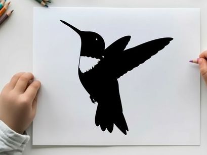 Silhouette of a hummingbird in flight with distinctive white throat patch