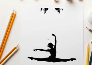Silhouette of a dancer in a dramatic pose