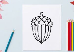 Cute acorn ornament with detailed cap. Decorative natural-inspired accessory for crafts and seasonal decor.