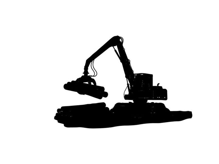 Silhouette of a large excavator machine in a black industrial setting