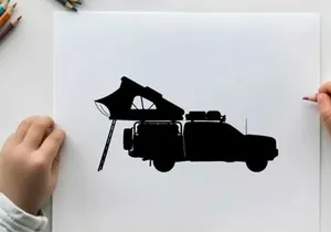 Silhouette of a pickup truck with a tent on the back