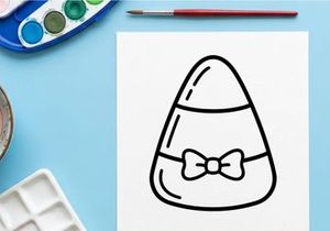 Candy corn icon with a bow tie. Halloween festive treat graphic for holiday design.