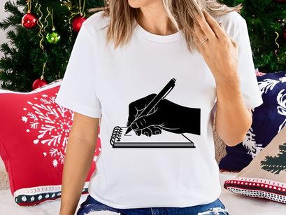 Hand writing in notebook with black pen on spiral bound paper