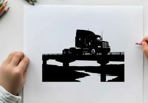 Silhouette of a semi truck driving across a bridge