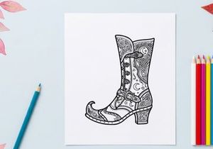 Hand-drawn vintage cowboy boot illustration. Retro western footwear sketch with ornate floral patterns and decorative stitching.
