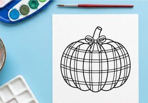 Plaid pumpkin line art illustration. Autumn harvest drawing with a decorative bow.