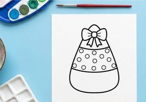 Candy corn coloring page. Cute Halloween treat drawing for kids activity.