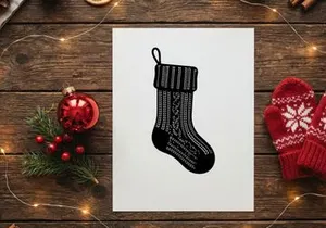 Black and white knitted Christmas stocking isolated on a clean white background