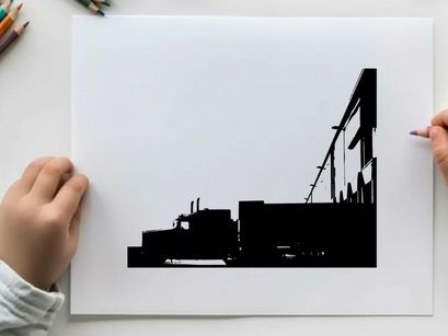 Silhouette of a semi truck parked beside a large building