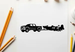 Silhouette of a pickup truck towing a racing boat
