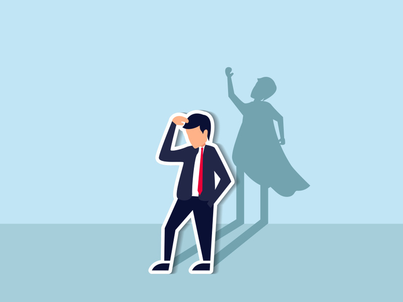 Self confidence or leadership to bring full potential and strength, motivation to achieve business success concept, self doubt businessman standing with his skillful power superhero shadow on the wall