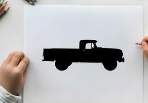 Silhouette of a classic pickup truck against a white background