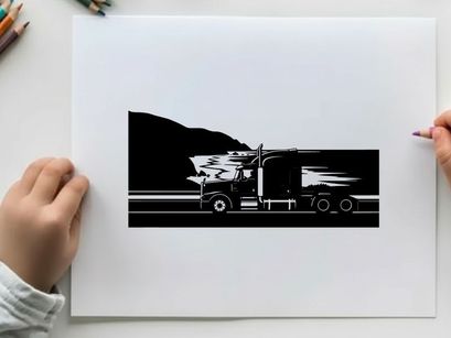 Truck driving along a coastal road in silhouette