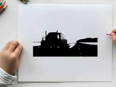 Silhouette of a semi truck driving on a highway at dawn or dusk