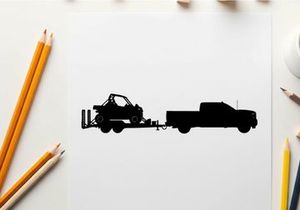 Silhouette of a truck towing a trailer with a vehicle