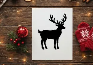 Black silhouette of a reindeer with large antlers isolated on a white background