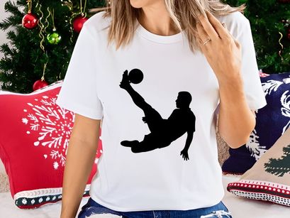 Silhouette of a soccer player performing an acrobatic kick