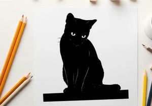 Black cat silhouette sitting on a platform looking forward