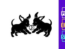 Two black dog puppies playing with metal ring toy silhouette