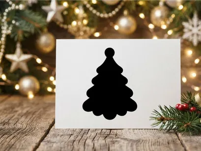 Minimalist black Christmas tree silhouette isolated on a white background.