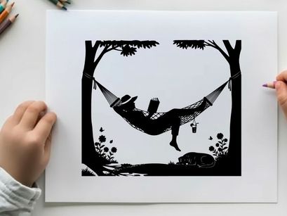 Silhouette of a person relaxing in a hammock between trees