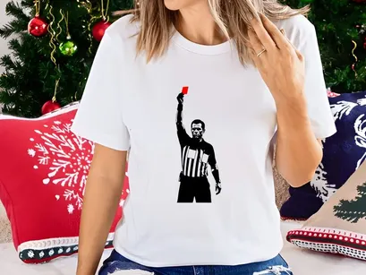 Referee holding a red card in a sports game for penalty or ejection