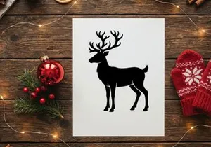 Black silhouette of a reindeer with large antlers isolated on a white background