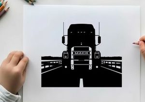 Silhouette of a mack truck on a bridge