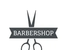 Barbershop logo in vintage style with the concept of scissors, razor and other tools.Logo for business, salon, label and barbershop.