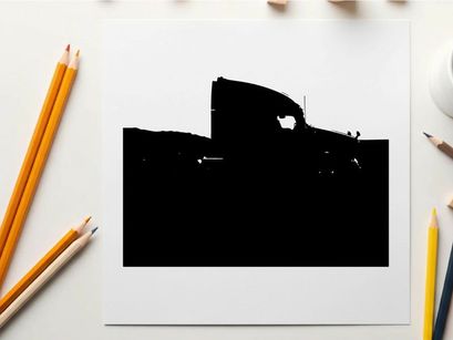 Silhouette of a semi truck driving on a road with mountains