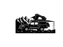 Silhouette of a car with a rooftop tent in a mountainous landscape silhouette