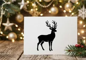 Black silhouette of a majestic deer with large antlers isolated on a white background.