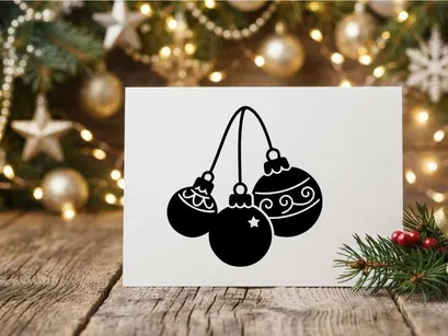 Festive Christmas ornaments hanging on string for holiday decoration