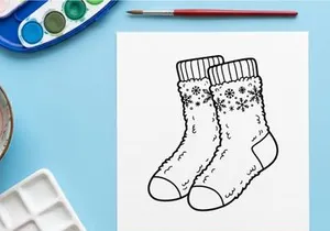 Pair of cozy winter socks with snowflake pattern, hand drawn line art illustration.